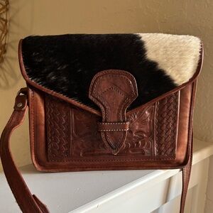 Leaders in Leather Western hand-tooled leather hair-on-cowhide crossbody bag.